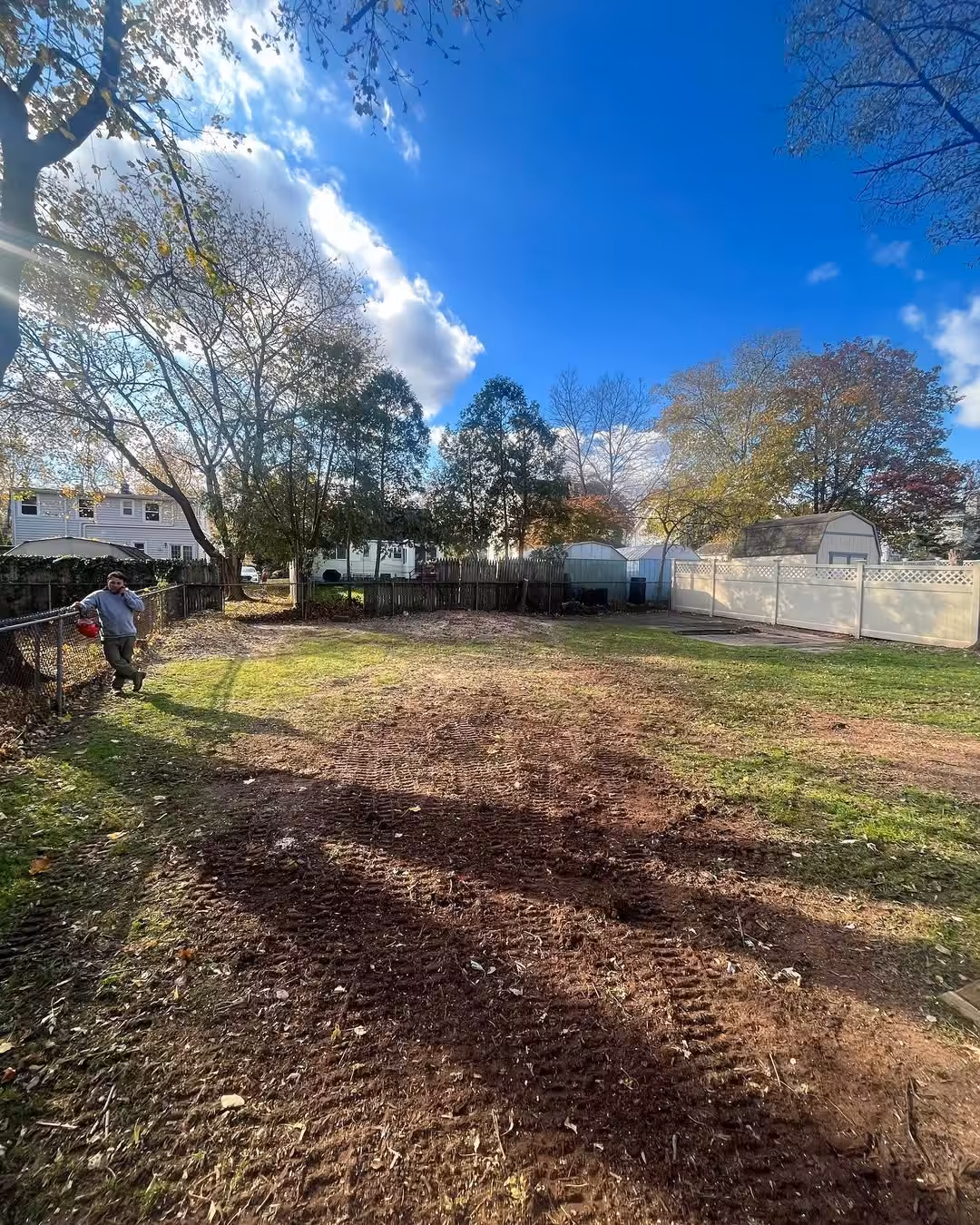 Freshly cleared backyard after land clearing and tree removal